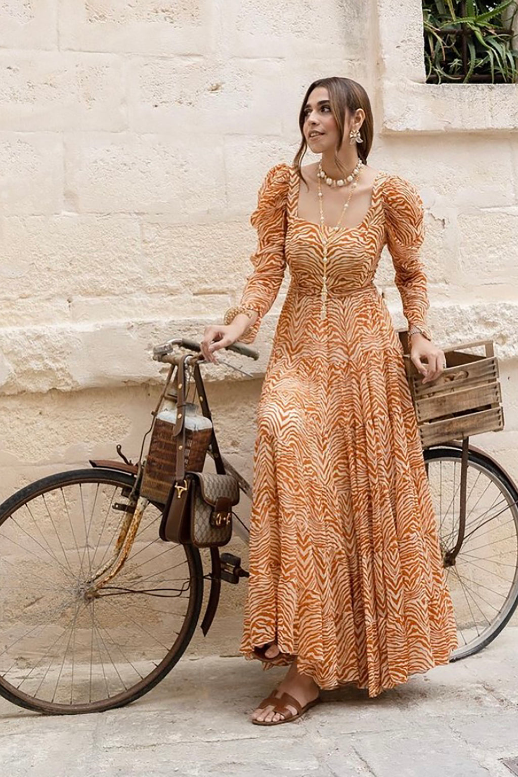 Pria Beniwal in Sander Tier Midi Dress