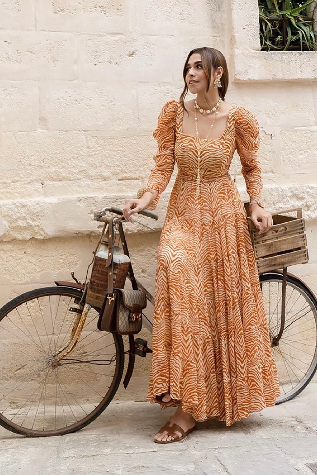 Pria Beniwal in Sander Tier Midi Dress