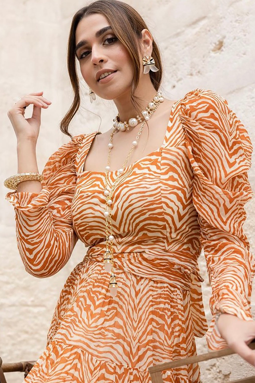 Pria Beniwal in Sander Tier Midi Dress