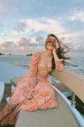 Pooja Hedge in Sander Bandeau & Tier Midi Skirt
