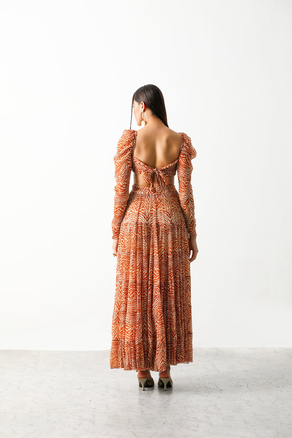 Pooja Hedge in Sander Bandeau & Tier Midi Skirt