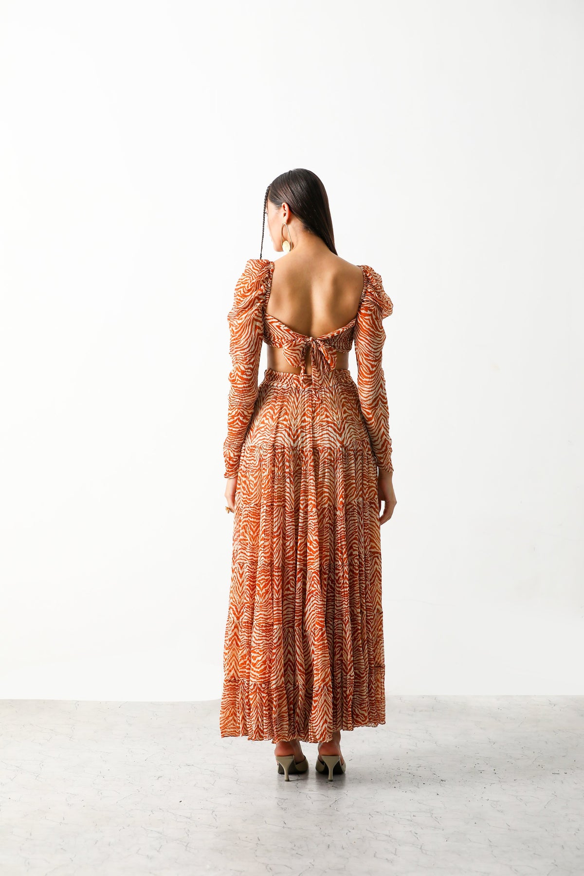 Pooja Hedge in Sander Bandeau & Tier Midi Skirt